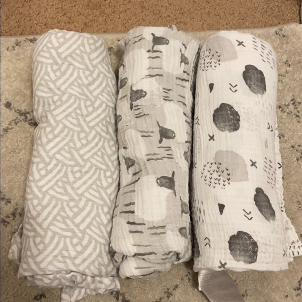 Three muslin swaddle blankets